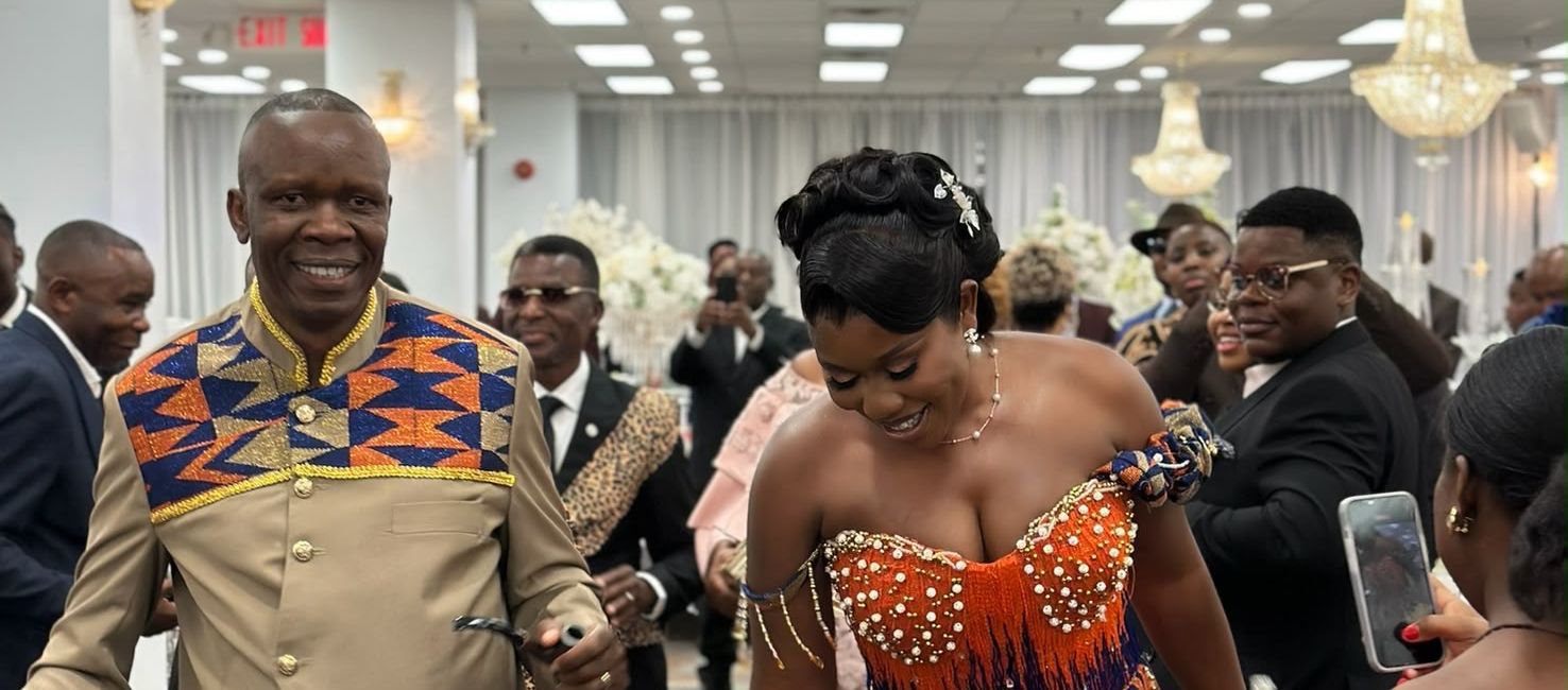 Community members in kente outfits at a ceremony